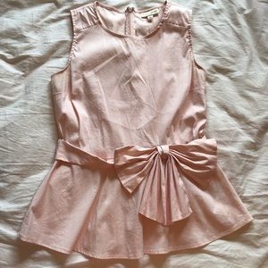 Pink blouse with bow peplum